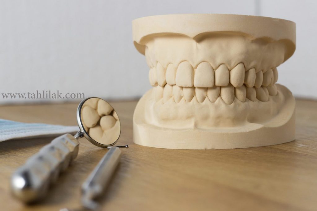 dentures on wood table
